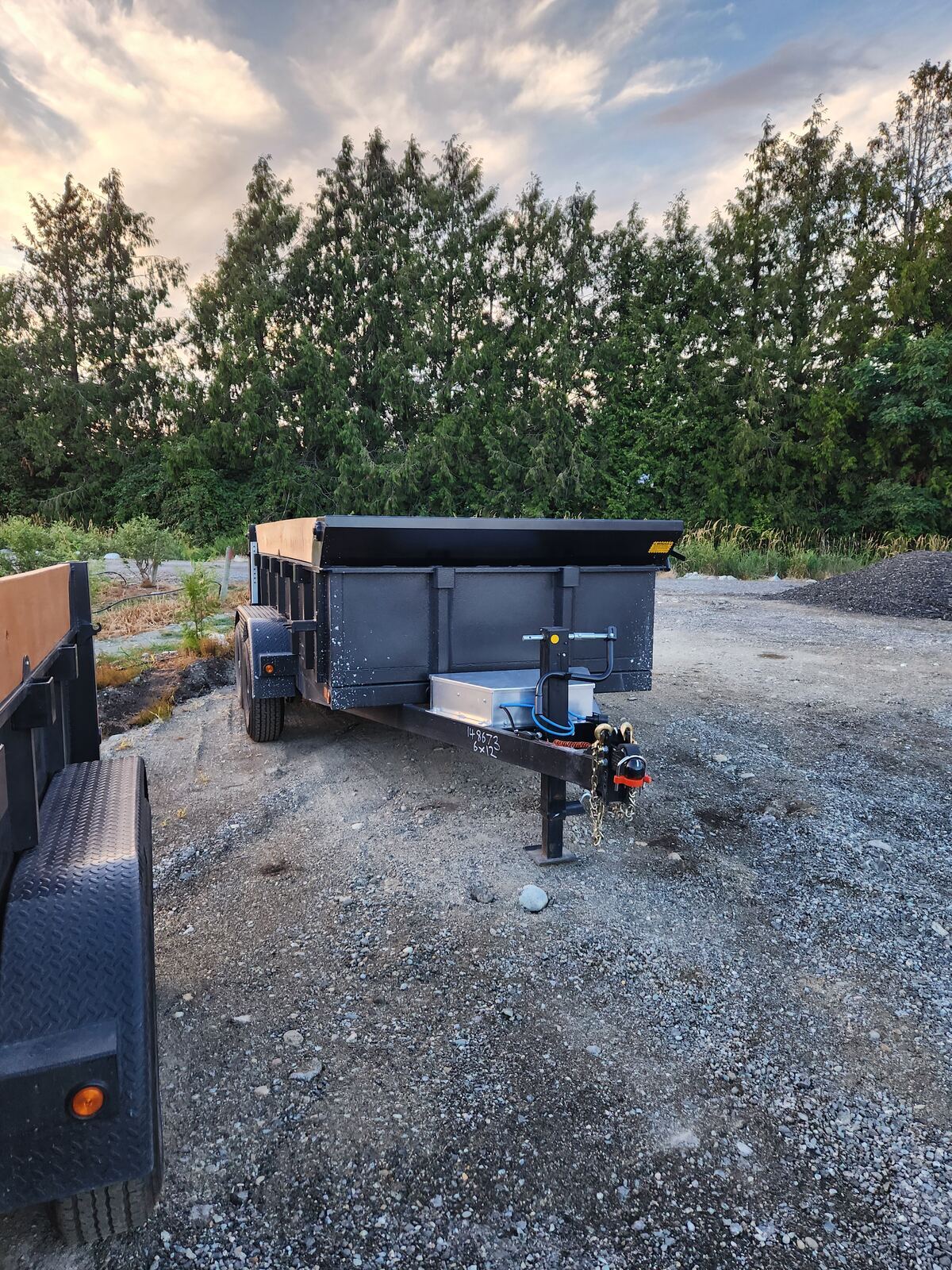 Hydraulic dump trailer rental with bed raised in Delta BC